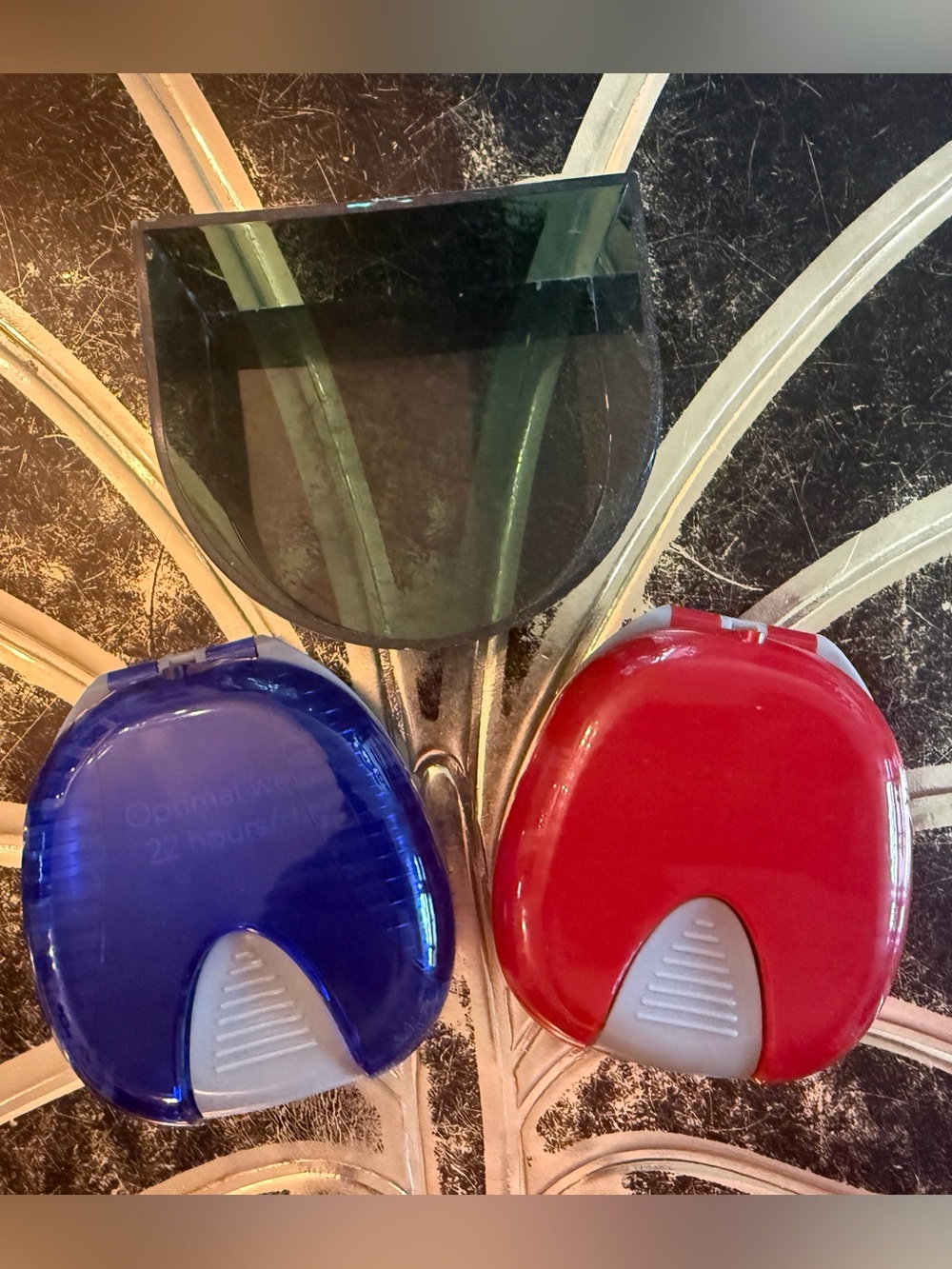 Invisalign red and blue cases with tray